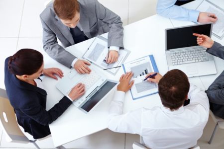 top-view-of-co-workers-planning-a-strategy_1098-2959