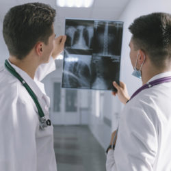 two-male-doctors-looking-at-x-ray_23-2147763808